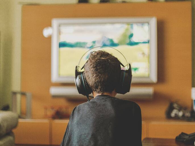 boy enjoying game console at home.Natural light