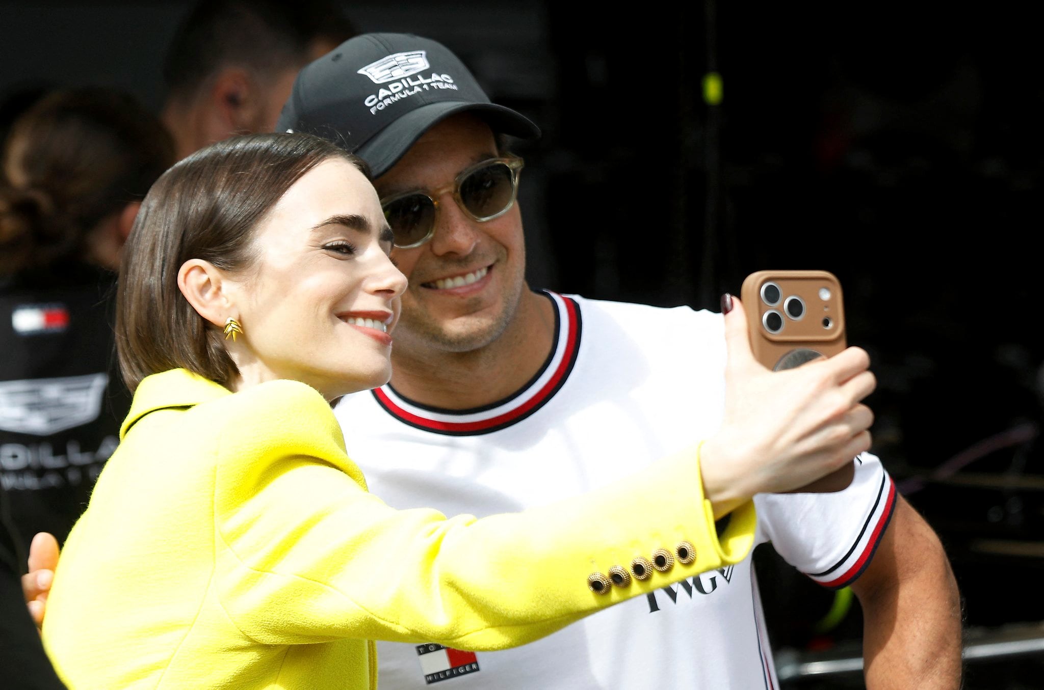 Lilly Collins y Checo Pérez