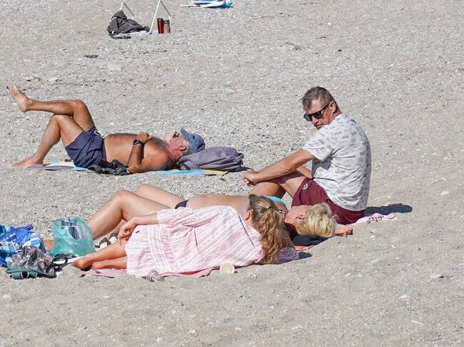 People enjoy the warm weather in Athens, Greece, on October 18, 2024. (Photo by Giannis Alexopoulos/NurPhoto via Getty Images)